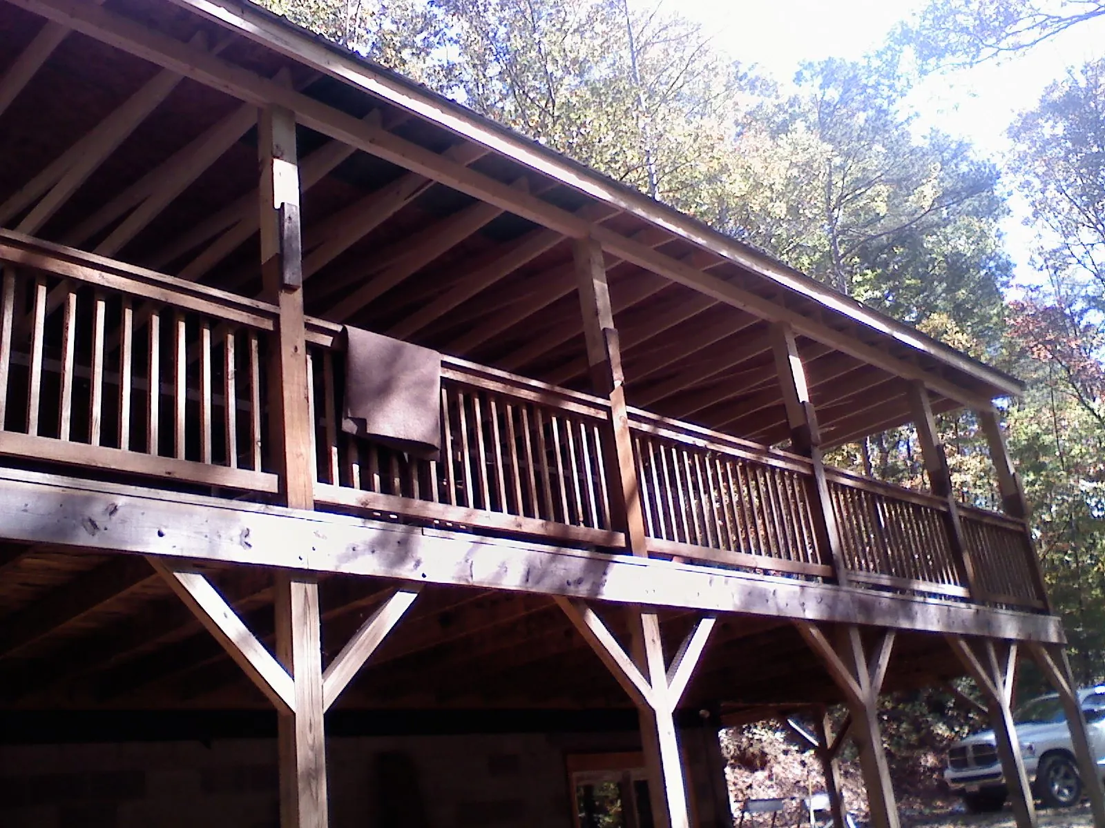 Timber framing under a new elevated porch and deck — Roof Leak Repair in Rock River by Roofing Brothers